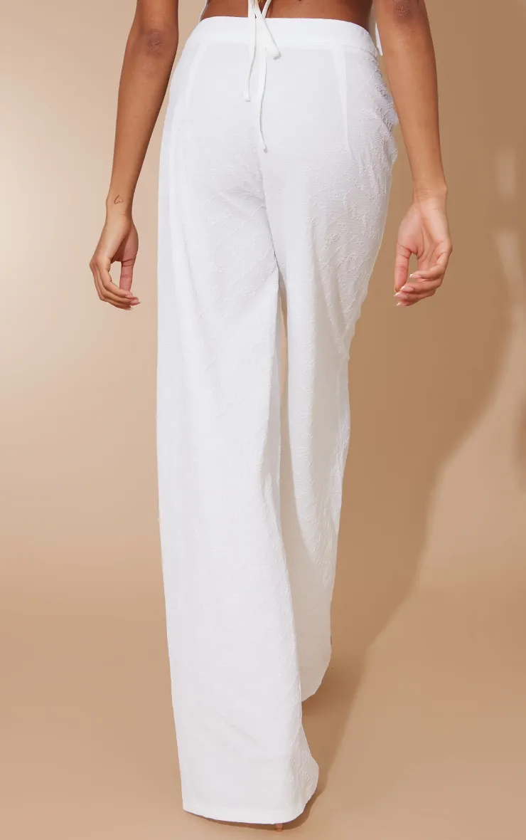 Pantalon de tailleur blanc taille haute à fleurs en jacquard